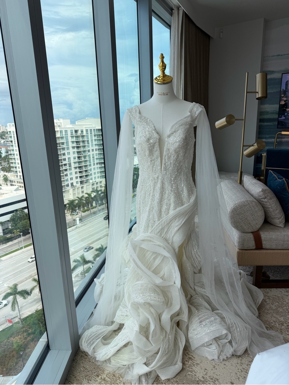 Elegant White Beaded Bridal Gown with Sheer Draped Sleeves